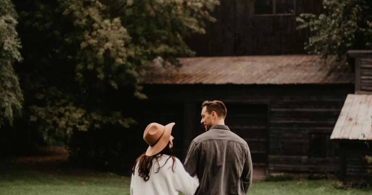 Couple sitting apart, reflecting on why love feels harder over time in relationships