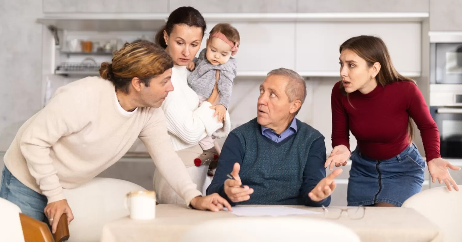 Family members pointing fingers during a conflict, illustrating scapegoating behavior in family dynamics