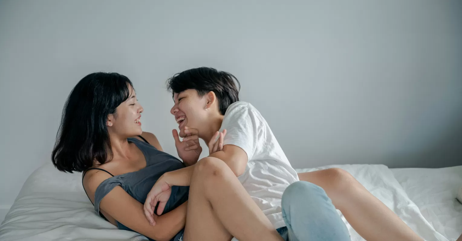 Couple enjoying a good moment while one partner appears withdrawn and distant