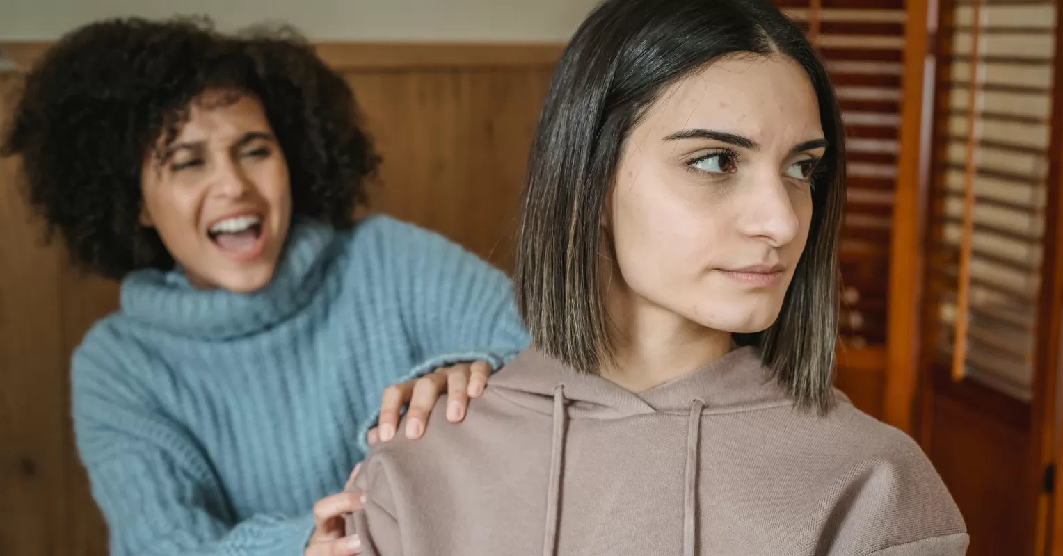 Couple sitting in silence, grappling with acceptance and resentment towards each other's flaws