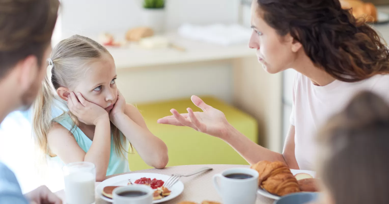 Child looking uncertain while parents display narcissistic behavior, illustrating trust issues in relationships