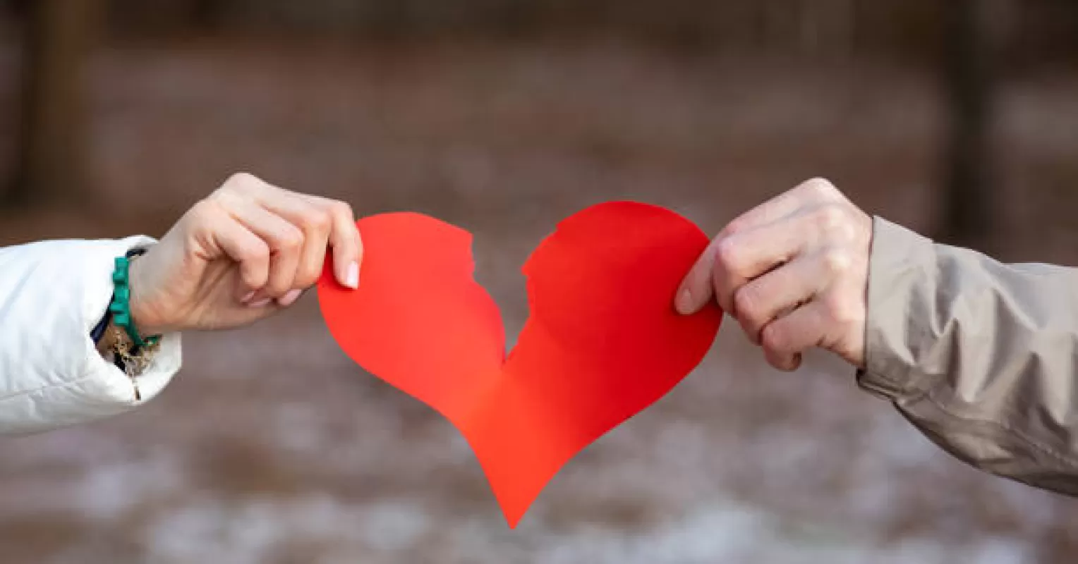 Couple scrolling through social media, feeling inadequate on Valentine’s Day