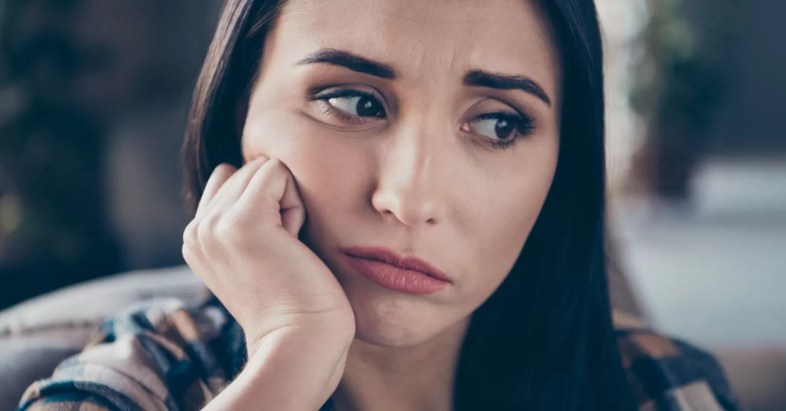 Individual struggling with vulnerability in a close relationship, feeling conflicted and anxious