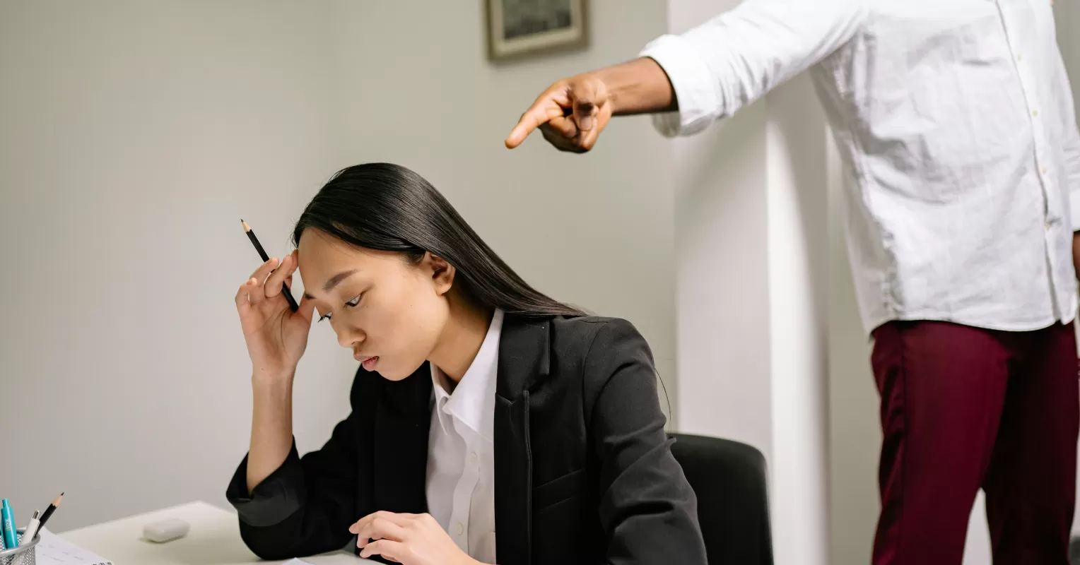 Individual contemplating their thoughts, concerned about sharing opinions due to fear of criticism