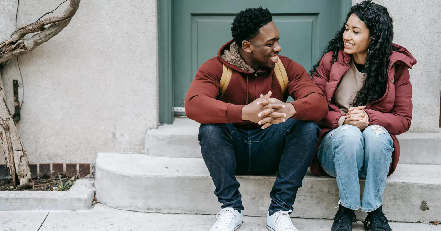 Individual feeling isolated in a social setting after experiencing trauma