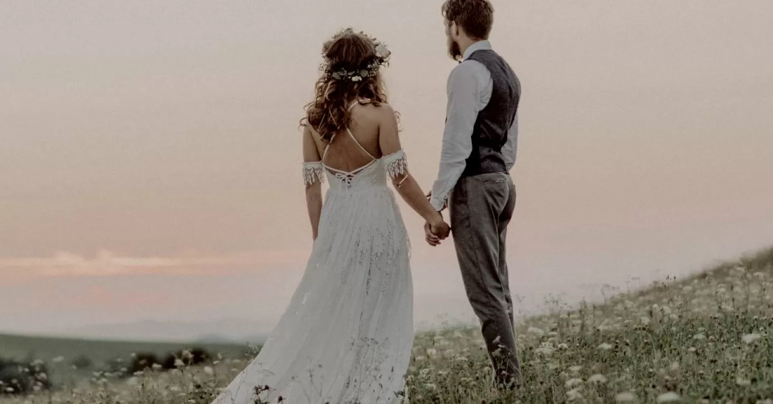 Couple sitting together but appearing distant, symbolizing emotional disconnect after marriage
