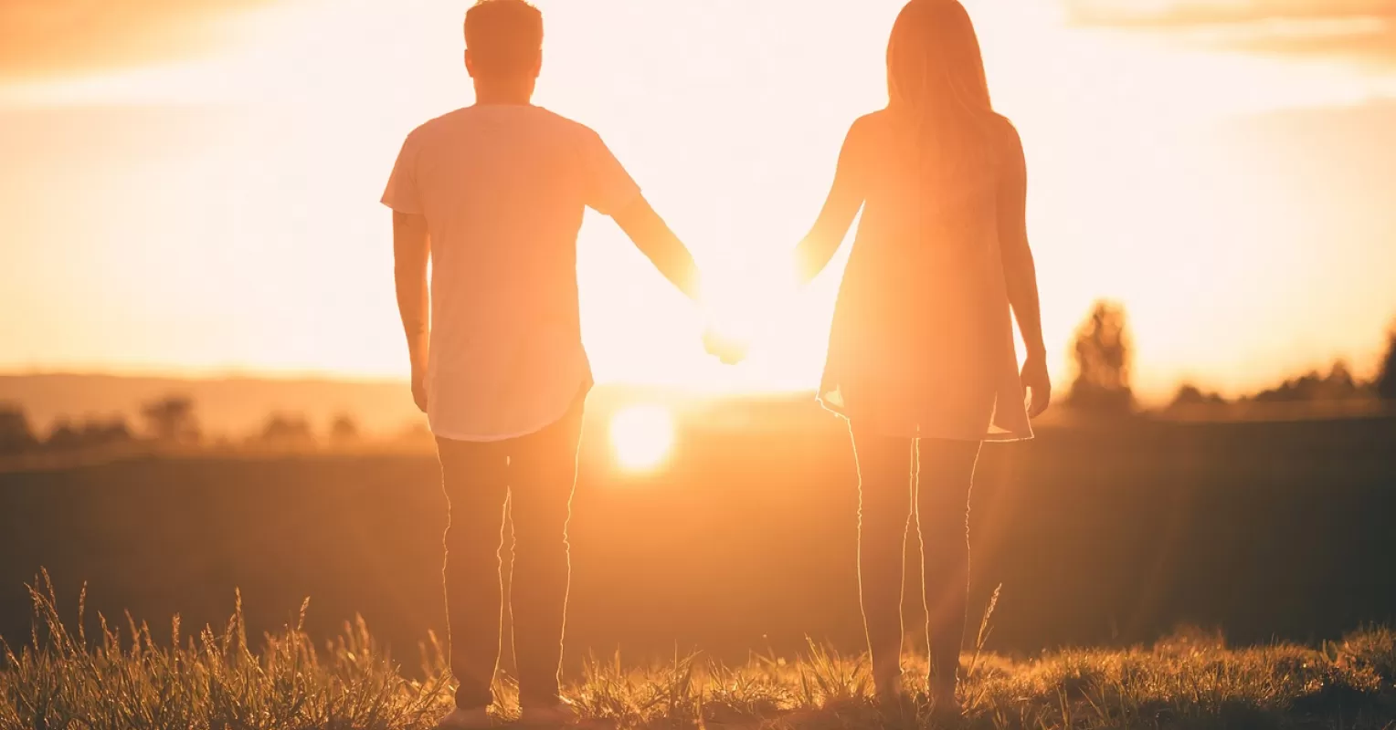 Couple sharing a joyful moment, exploring ways to bring excitement back into a relationship