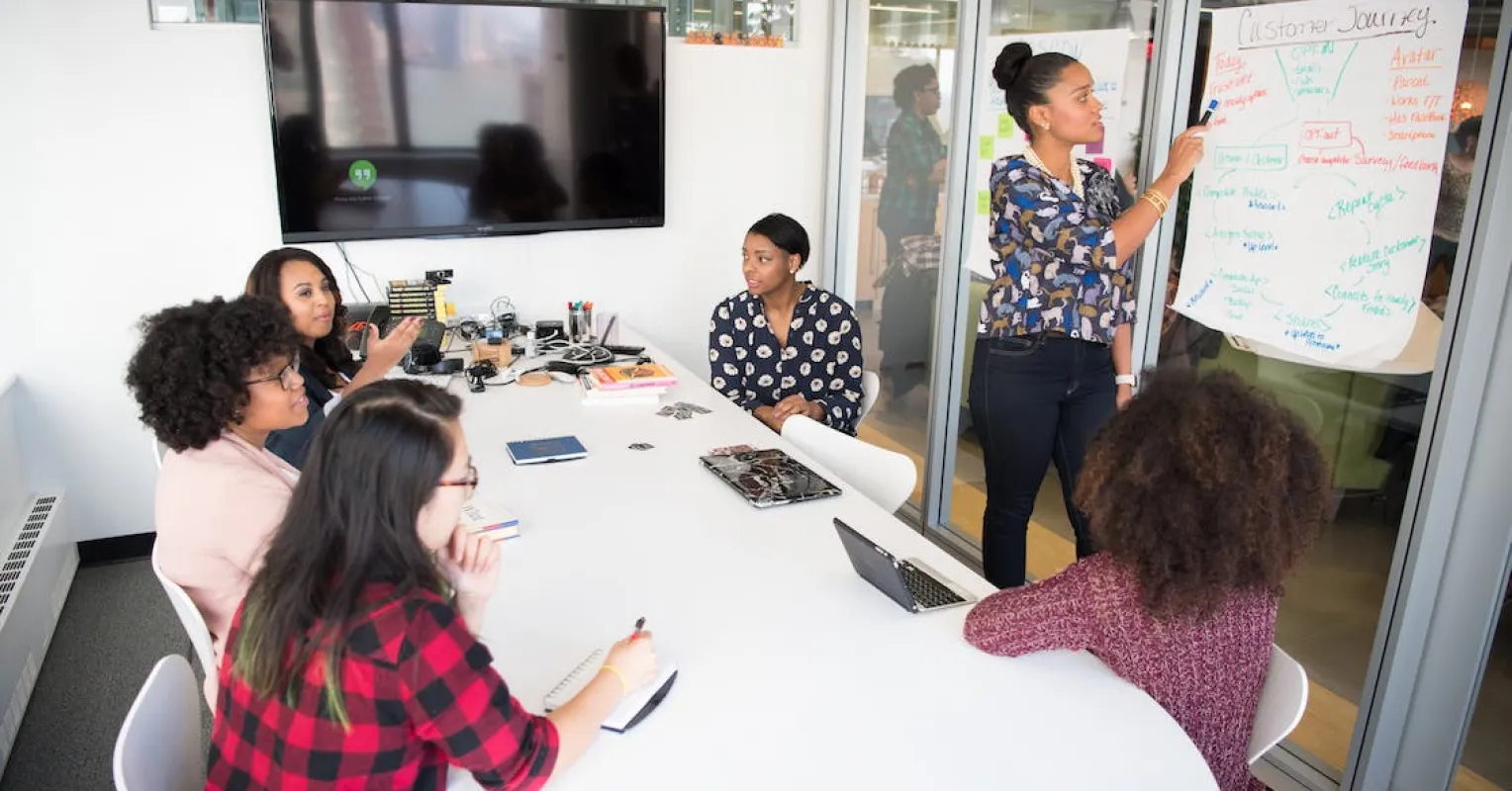 Colleagues exchanging tense glances, reflecting on passive-aggressive coworker dynamics