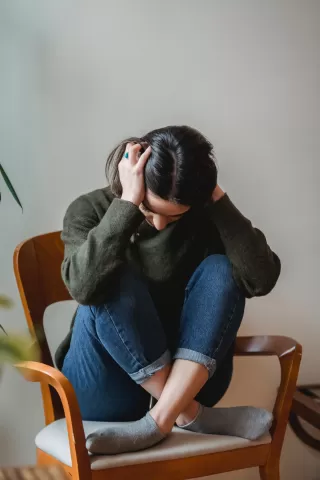 Friend offering comfort to another during a difficult emotional moment, highlighting support signals.