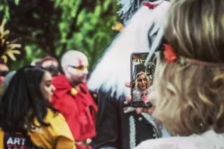 Individuals displaying self-centered behavior in a group setting, reflecting on rising narcissism