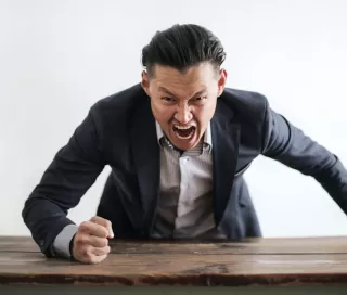 Person reflecting on emotional behavior and meaning connected to people laugh at inappropriate times