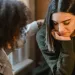 Person comforting a friend while discussing words for grief support