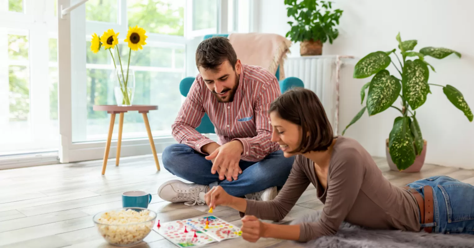 Couple sitting apart, reflecting on why they stay in unhappy marriages despite emotional disconnect.