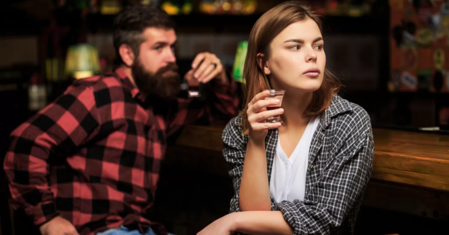 Nervous individual contemplating how to approach someone they like amidst mixed relationship signals