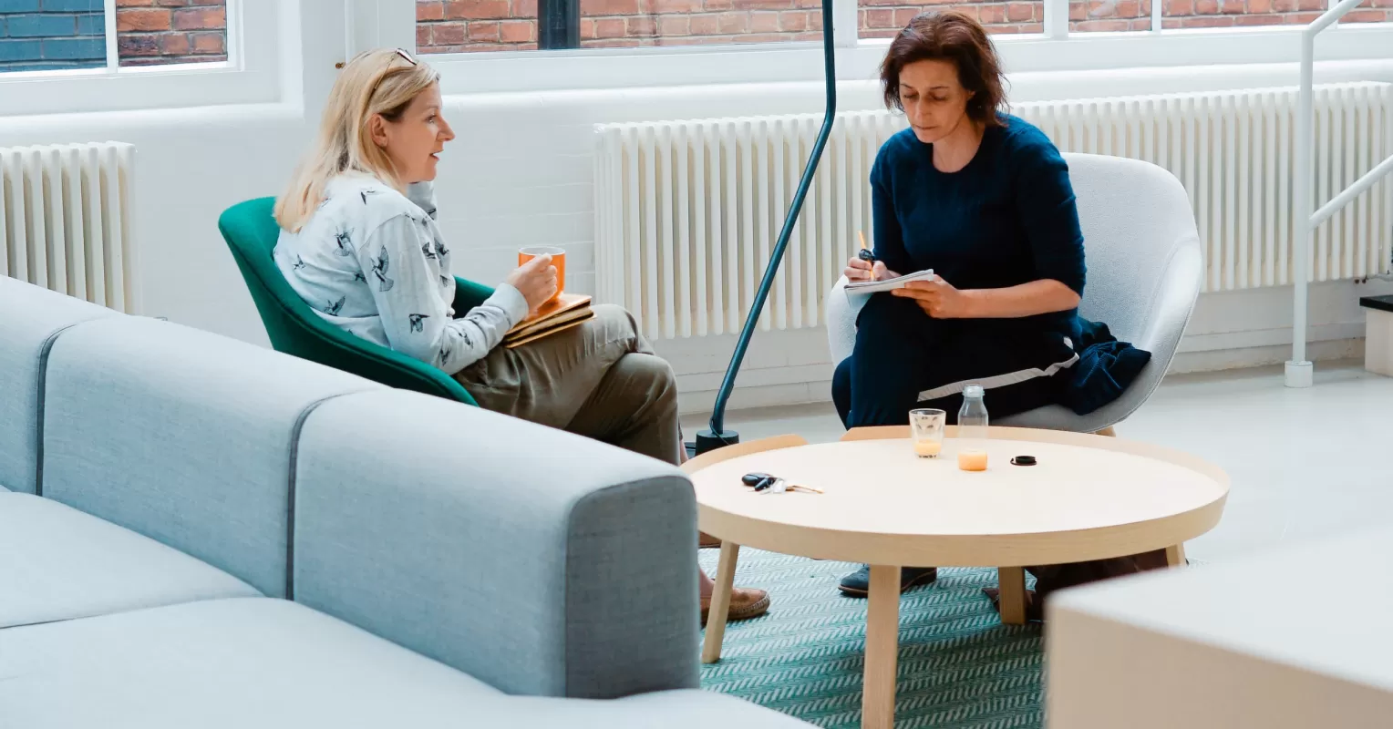 Individual seeking constructive feedback in a supportive conversation, navigating relationship signals