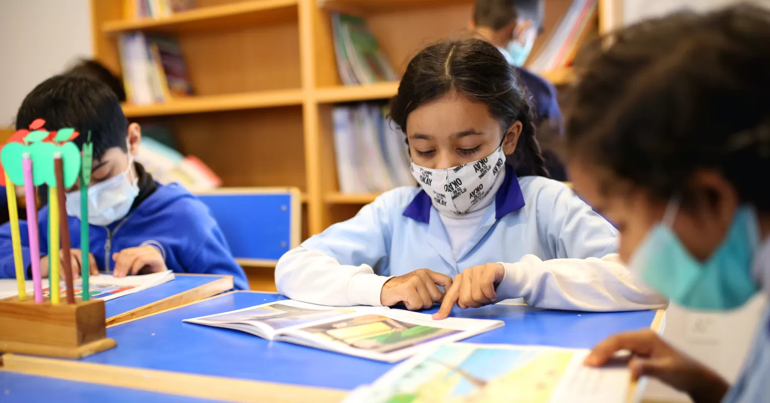 Students collaborating in a classroom, fostering community and belonging in schools