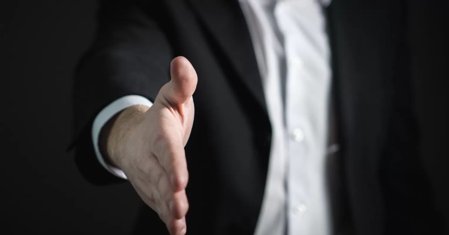 Individual preparing to confront a friend about dishonesty in a tense social setting