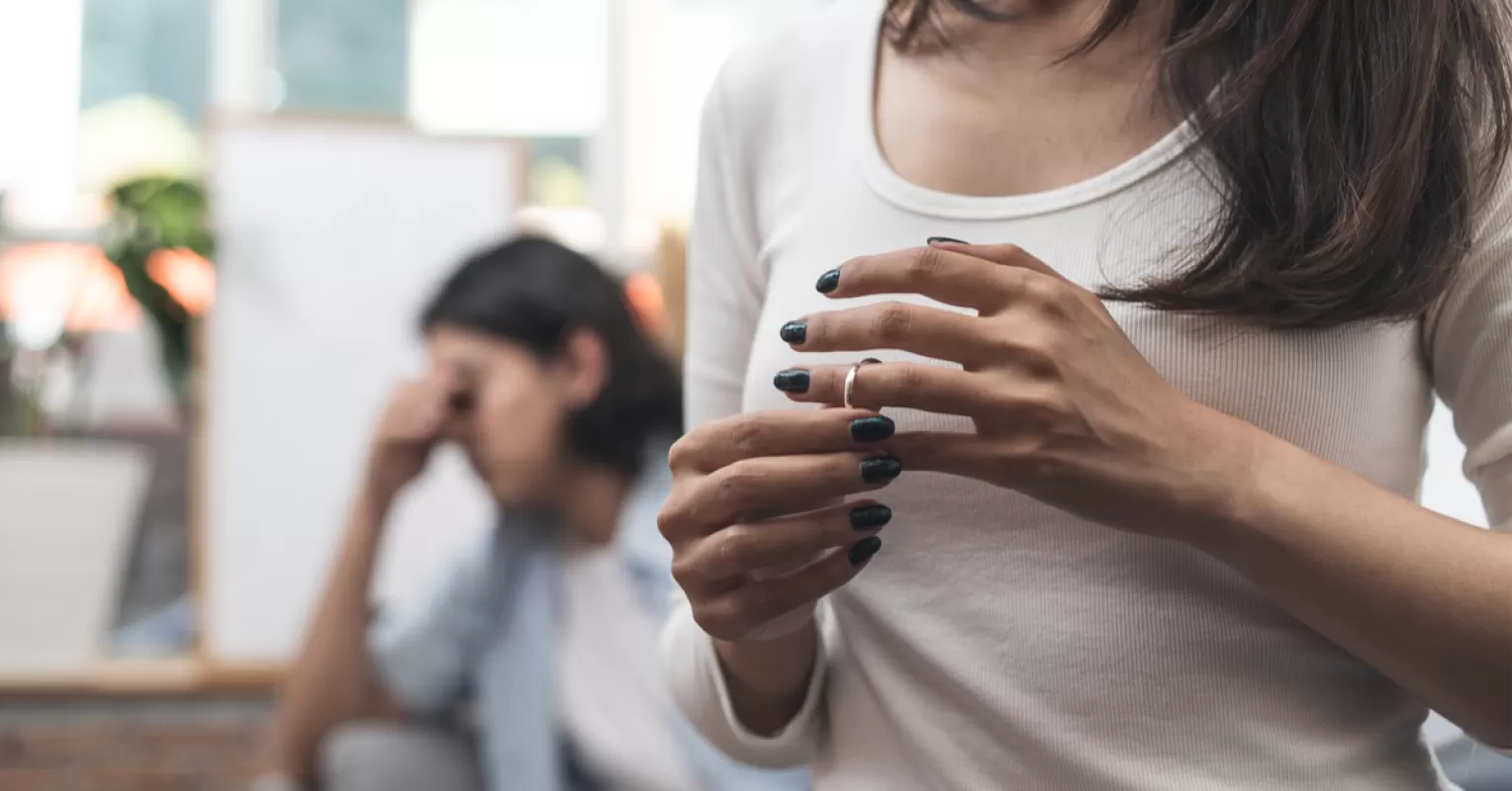 Woman reflecting on her emotions while contemplating how to cope with divorce as a woman