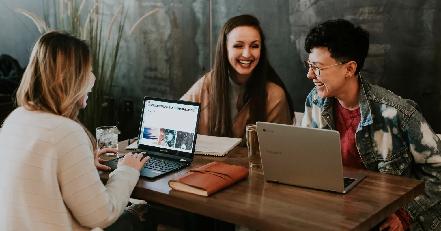 Team members collaborating and building meaningful connections in a positive work culture