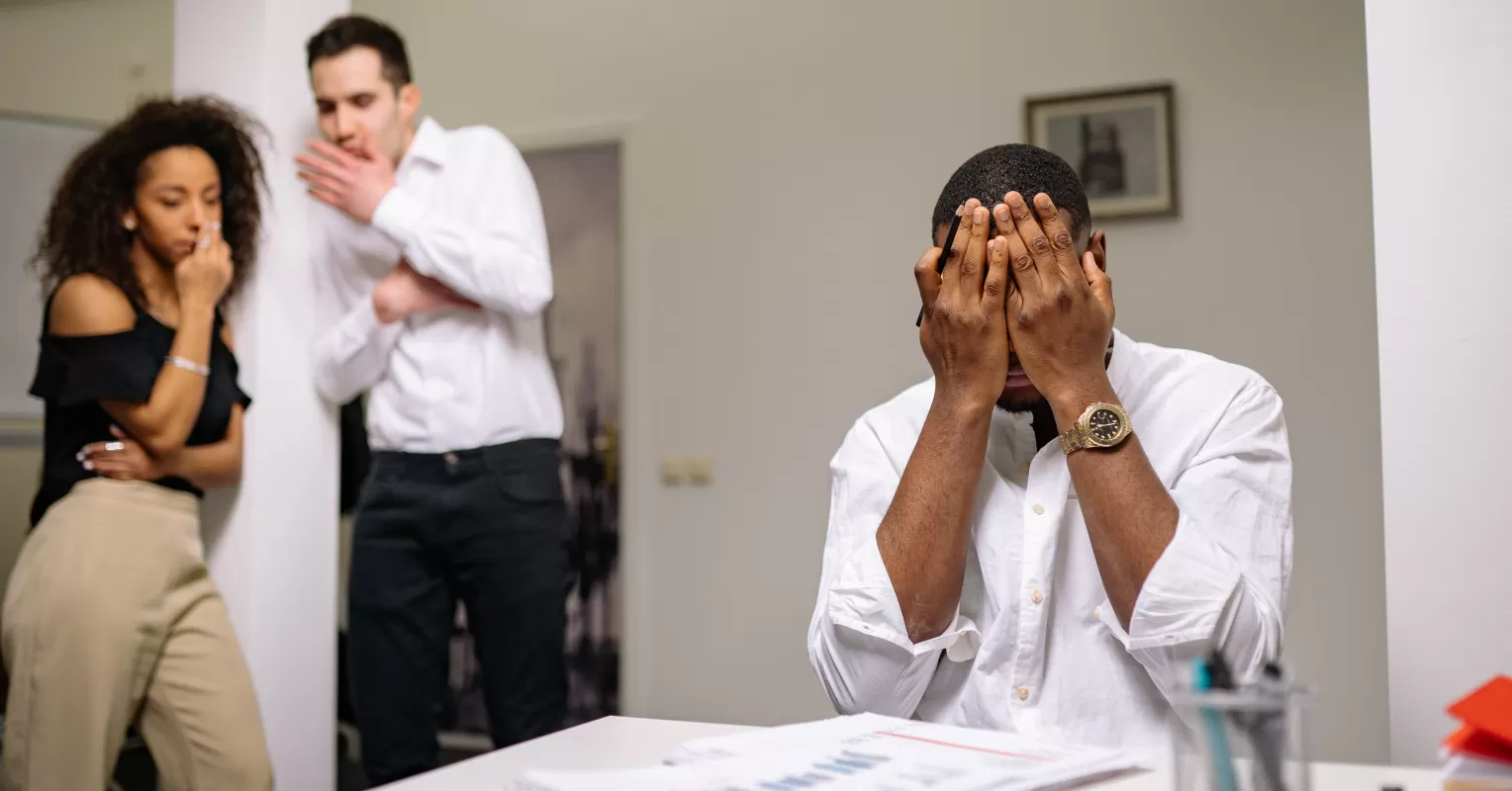 Colleagues navigating tense interactions while addressing passive-aggressive behavior in the workplace