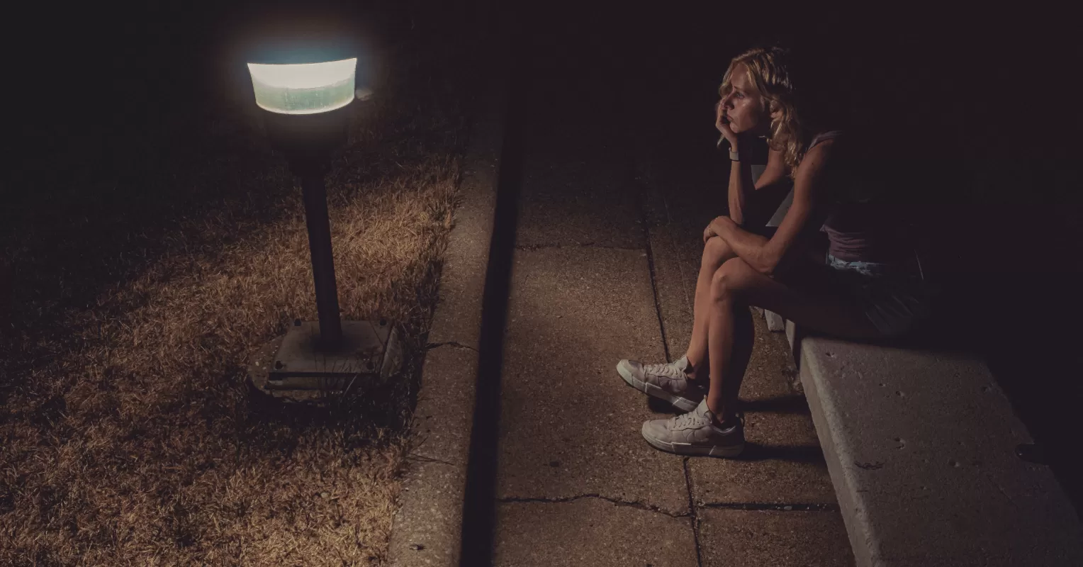 Individual contemplating feelings of abandonment after being ghosted by a friend