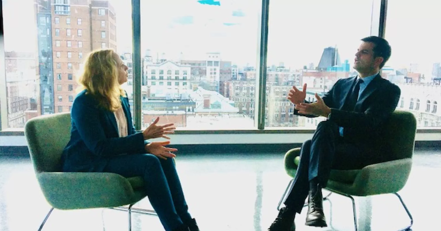 Person engaging in lively small talk, enhancing social dynamics and connection skills