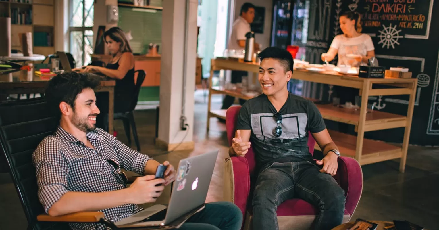 Adult engaging in conversation, demonstrating effective social skills in a group setting