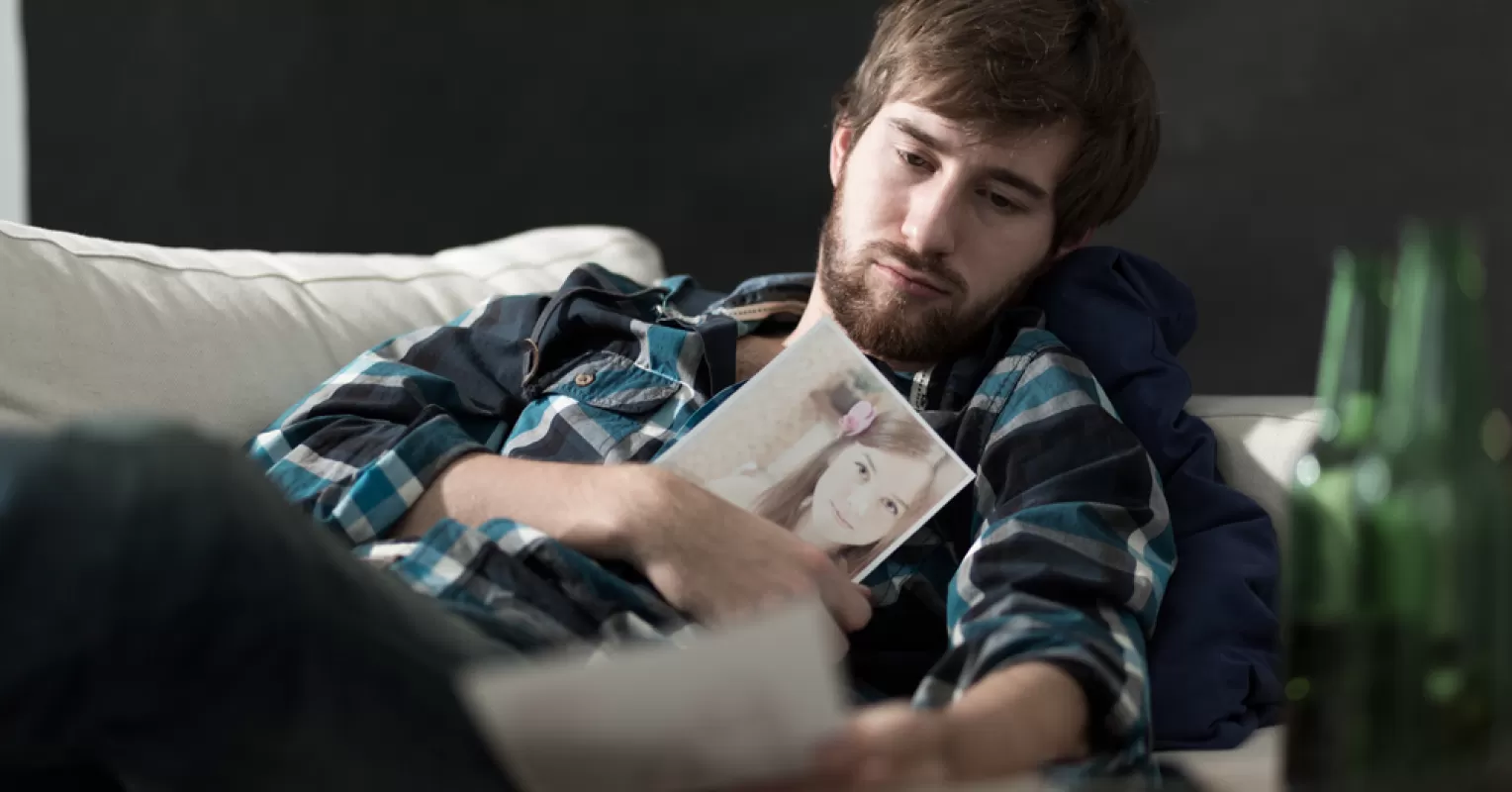 Individual contemplating readiness for dating again, reflecting on personal feelings and past experiences
