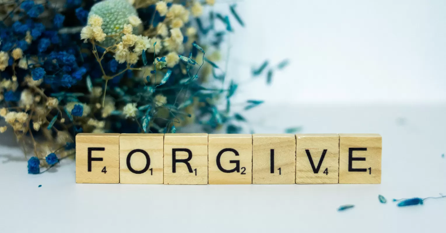 Individual practicing mindfulness to release anger and resentment in a peaceful setting