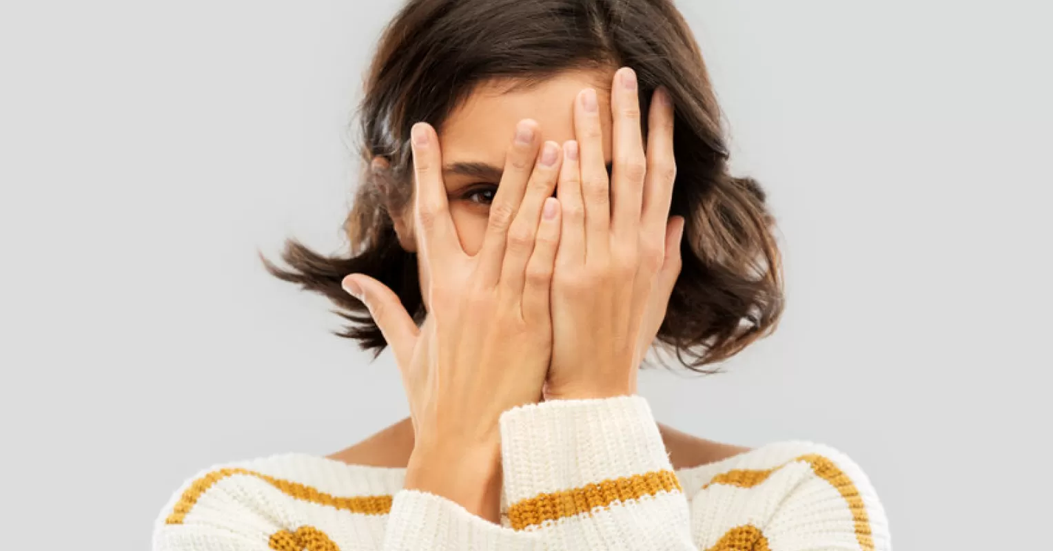 Individual reflecting on feelings of shame while journaling for emotional clarity