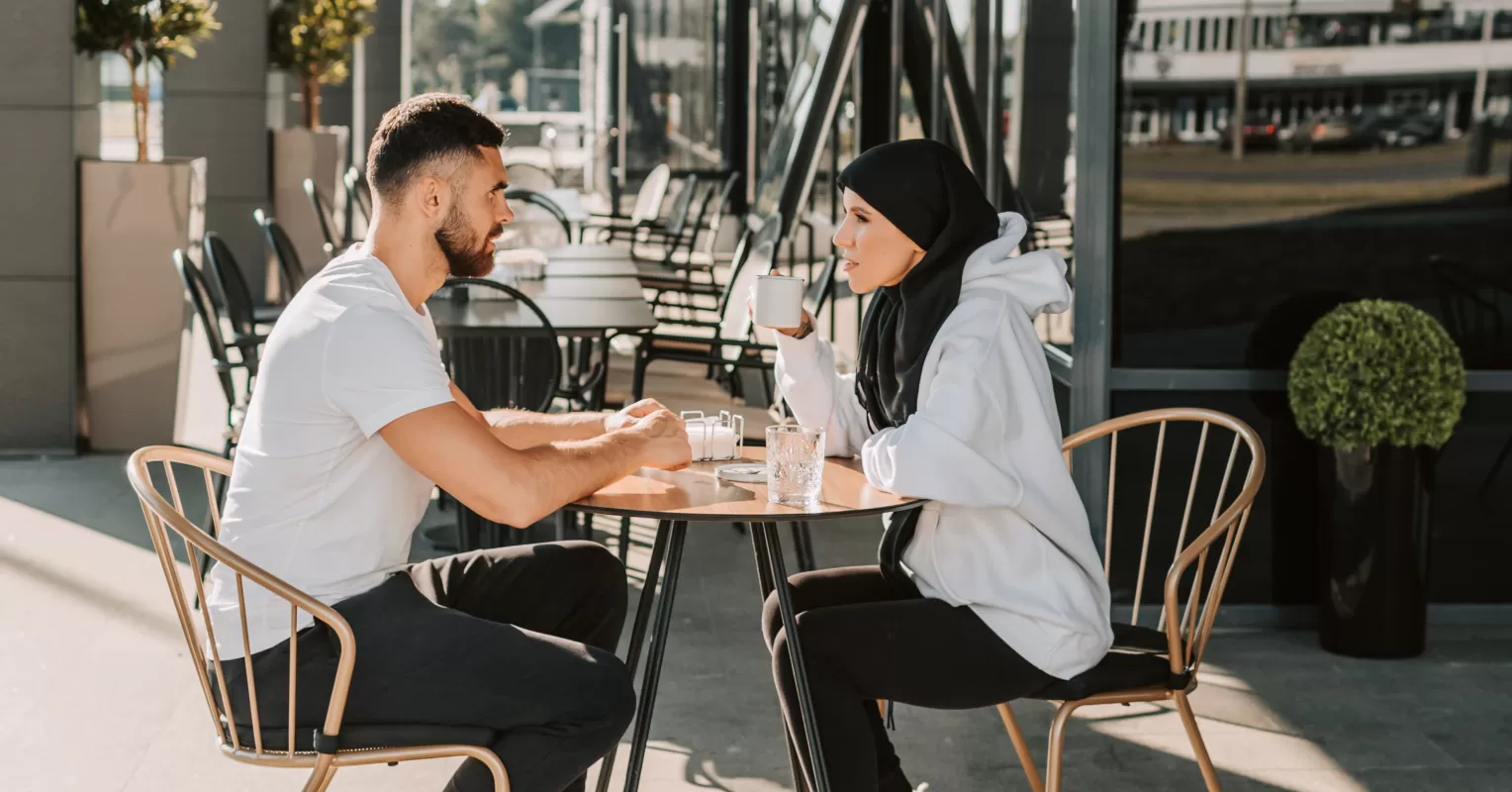 Individual practicing conversation skills to overcome shyness when meeting new people