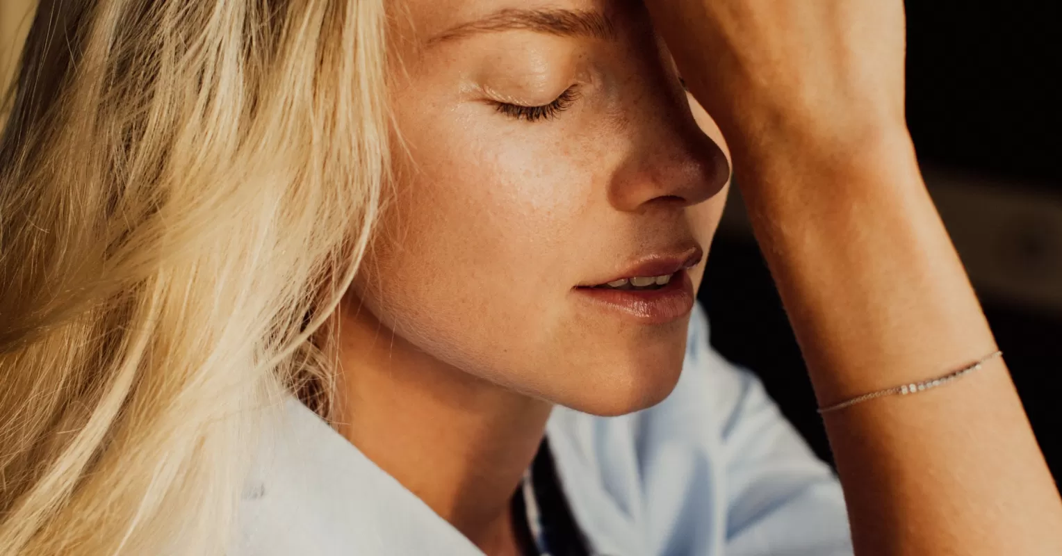 Person engaging in self-reflection to practice self-compassion daily amidst social dynamics