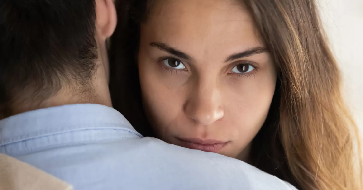 Couple discussing emotional boundaries to heal after infidelity in a cozy setting