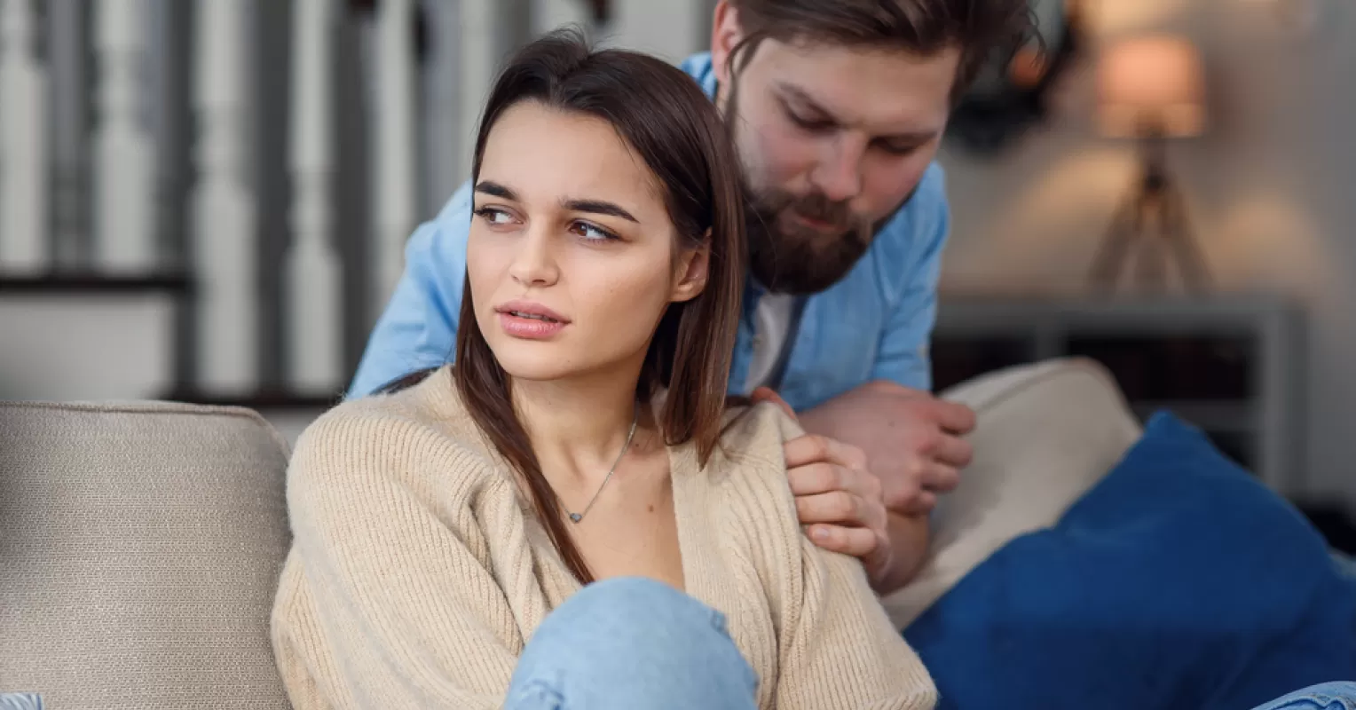 Individual contemplating self-worth while reflecting on the need for approval from others
