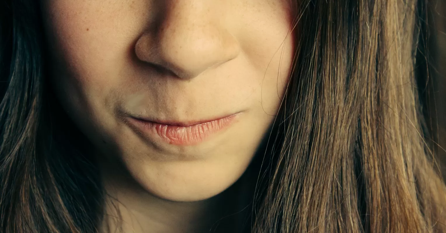Individual observing subtle body language cues to determine if someone is lying