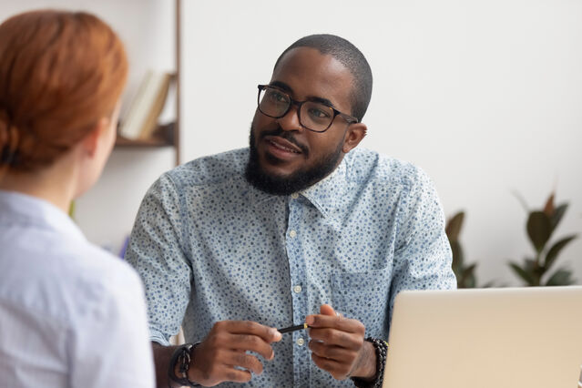 Couple engaged in deep conversation, practicing how to listen without interrupting each other
