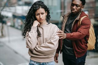 Individual expressing vulnerability while seeking reassurance in an emotionally needy relationship
