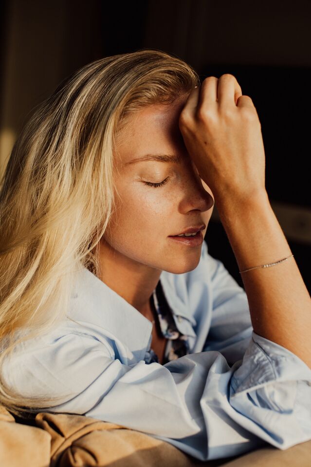 Individual engaging in self-reflection, embodying how to practice self-compassion daily.