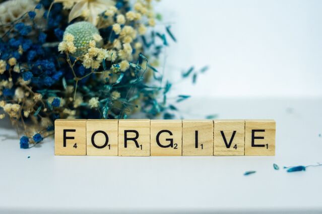 Individual practicing mindfulness to release anger and resentment in a peaceful setting