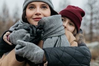 Adult child reflecting on the impact of a critical mother on their emotional well-being