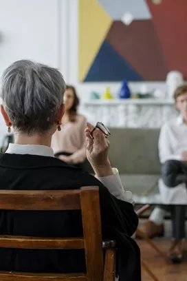 Couple discussing feelings of betrayal and trust issues in a cozy setting