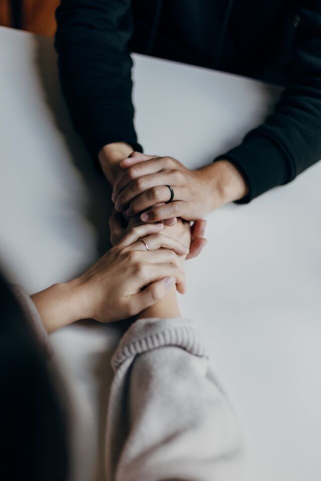 Individual practicing mindfulness to release anger and resentment in a peaceful setting