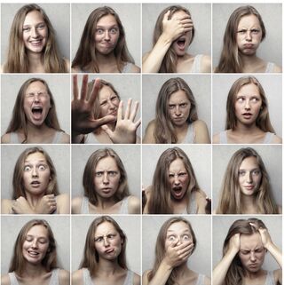 Individual laughing while masking deeper emotions, illustrating humor as a defense mechanism