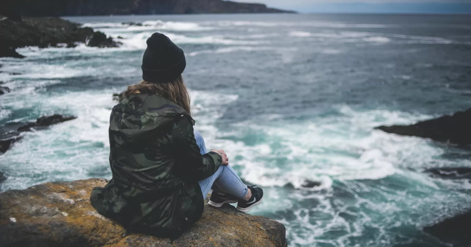 Couple sitting apart, reflecting on what it means to have intimacy issues in their relationship