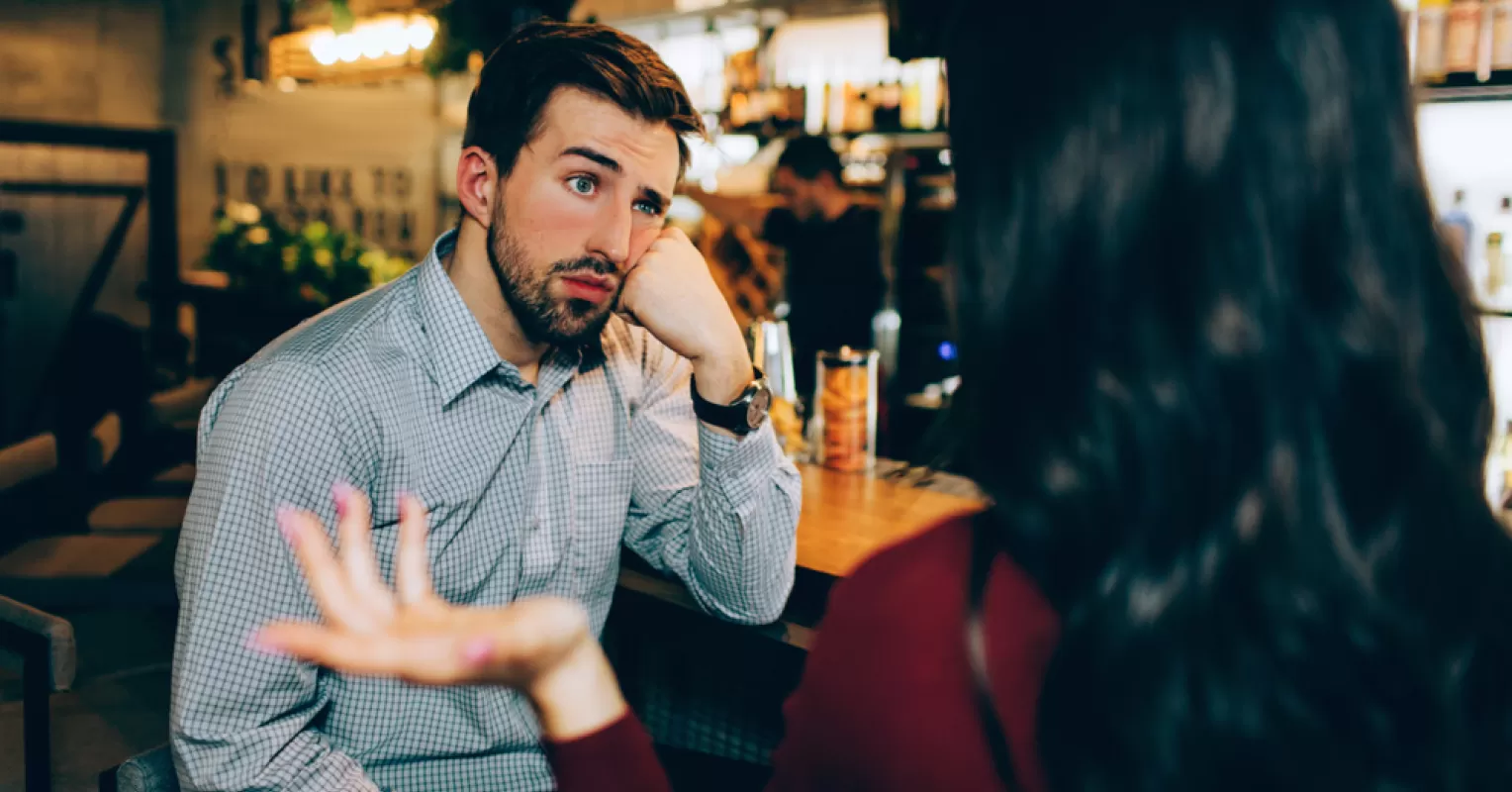 Individual reflecting on social dynamics and perceptions of being boring in conversations