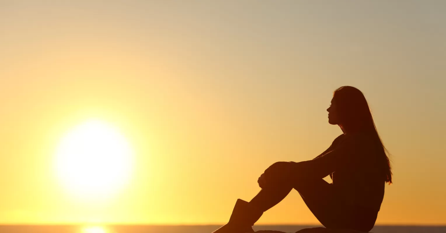 Person reflecting on emotional behavior and meaning connected to what does it mean to be highly sensitive