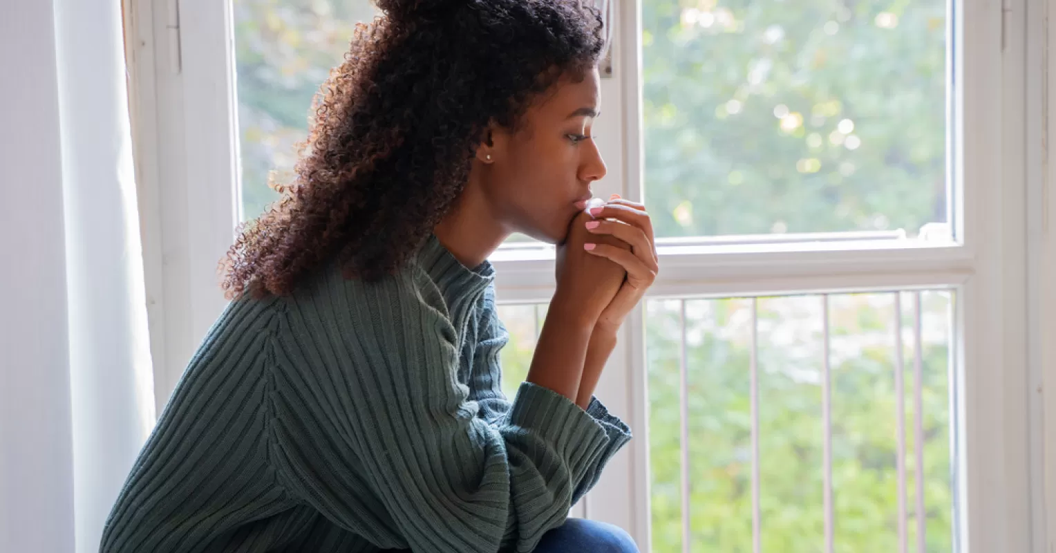 Person reflecting on emotional behavior and meaning connected to what does it mean to be scapegoated