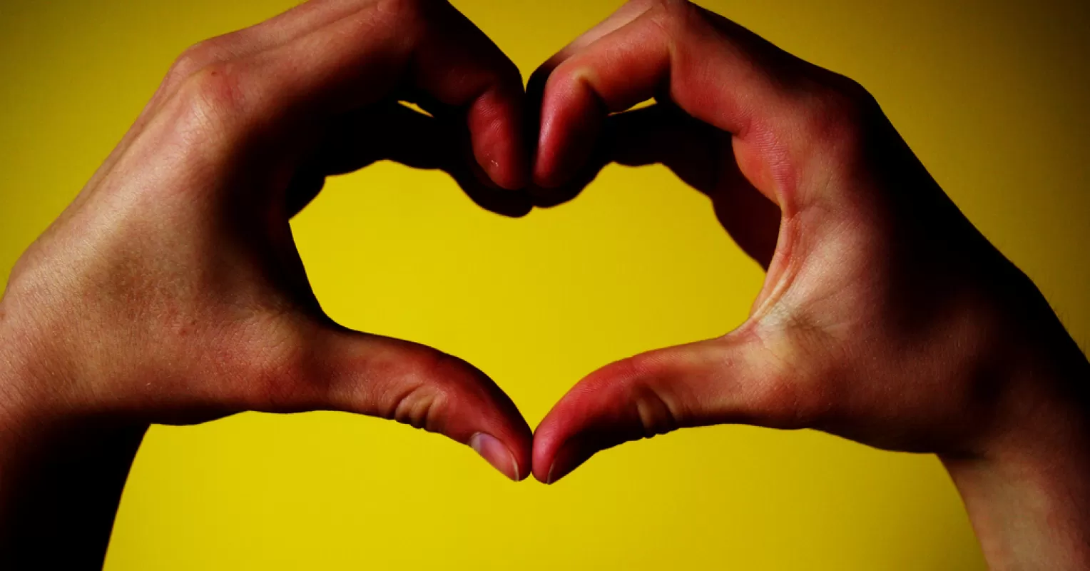 Individual confidently expressing self-worth in a supportive relationship, highlighting high self-esteem