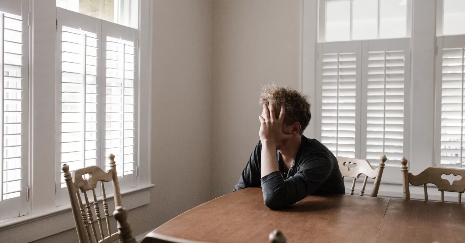 Person reflecting on emotional behavior and meaning connected to what does it mean to regulate emotions