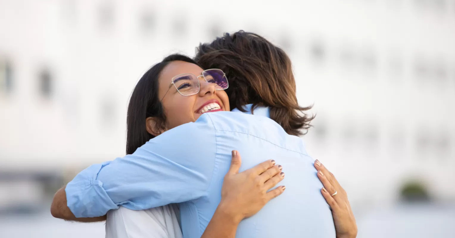 Person reflecting on emotional behavior and meaning connected to someone hugs you tightly